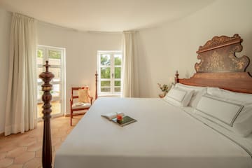a bed with a book on it