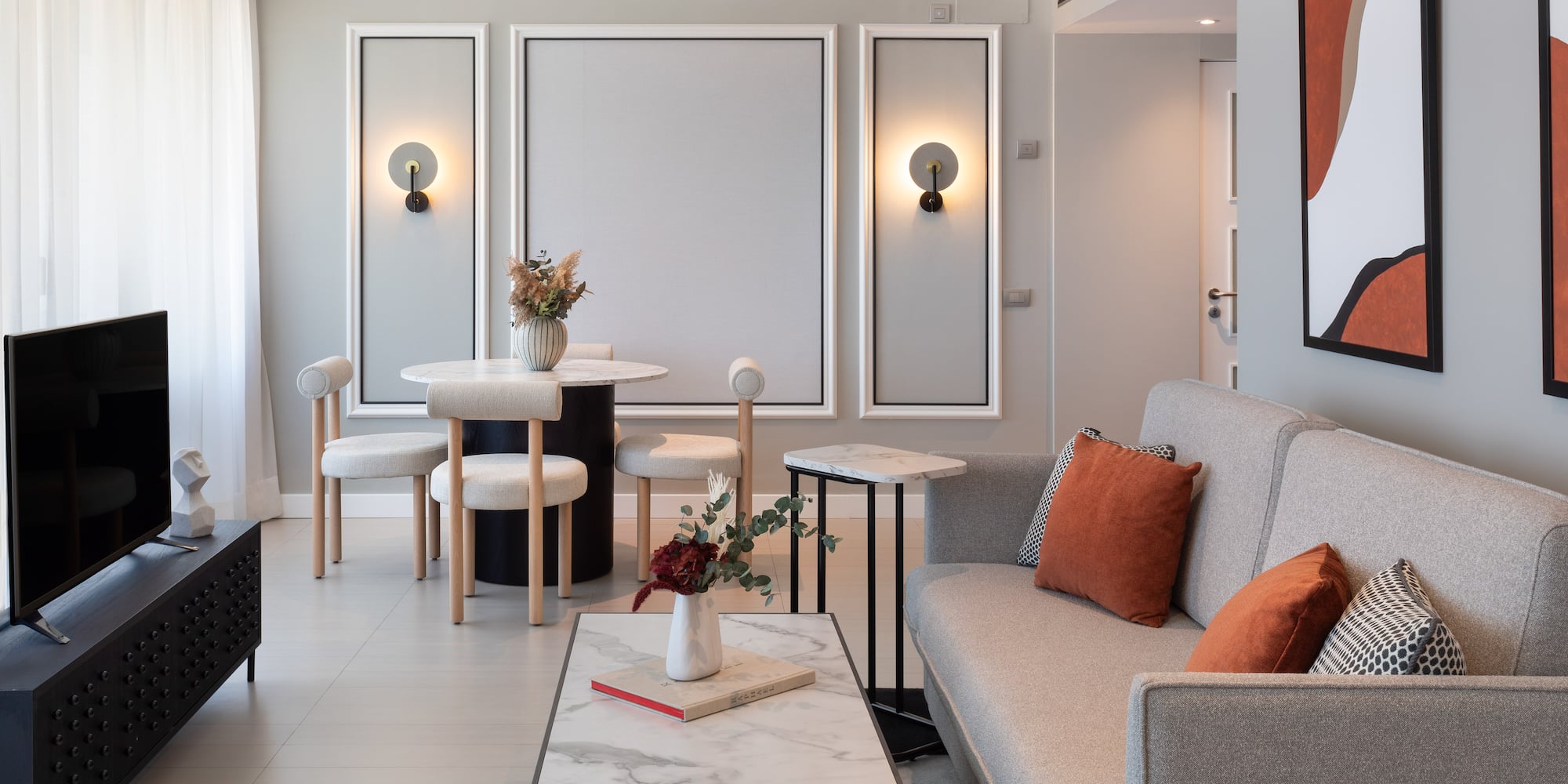 a living room with a couch and table