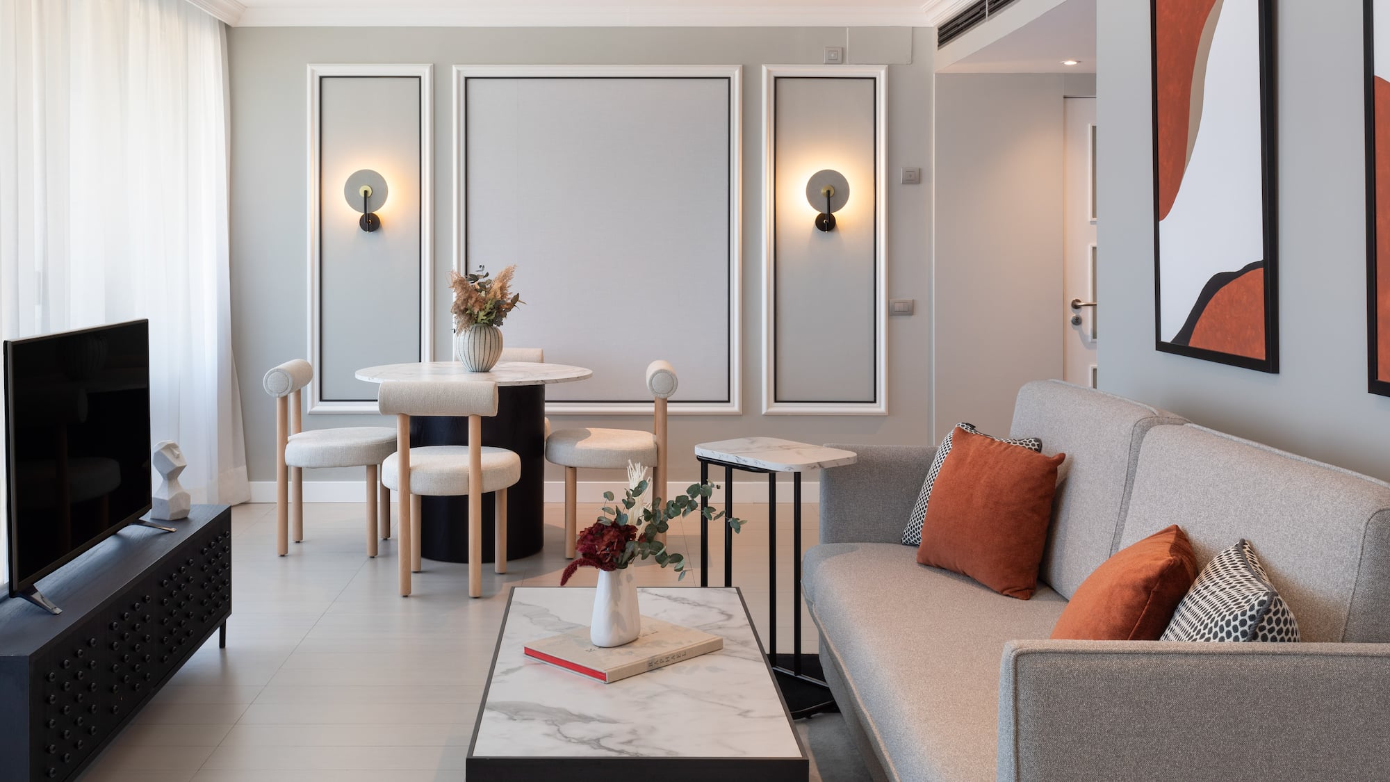 a living room with a couch and table