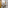 Modern hotel bathroom with marble vanity, sink, mirror, toiletries, and toilet.