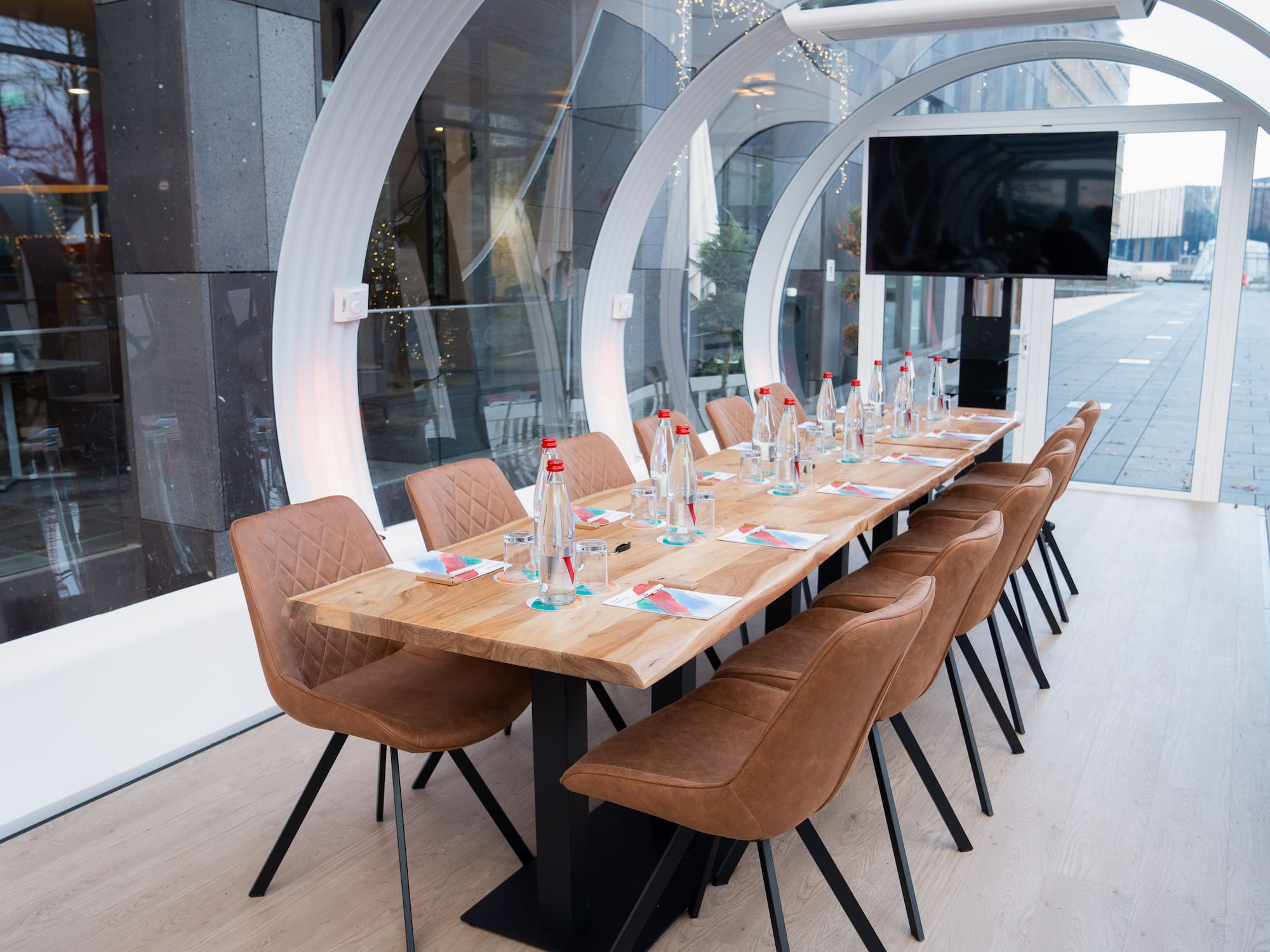 a table with chairs and bottles on it
