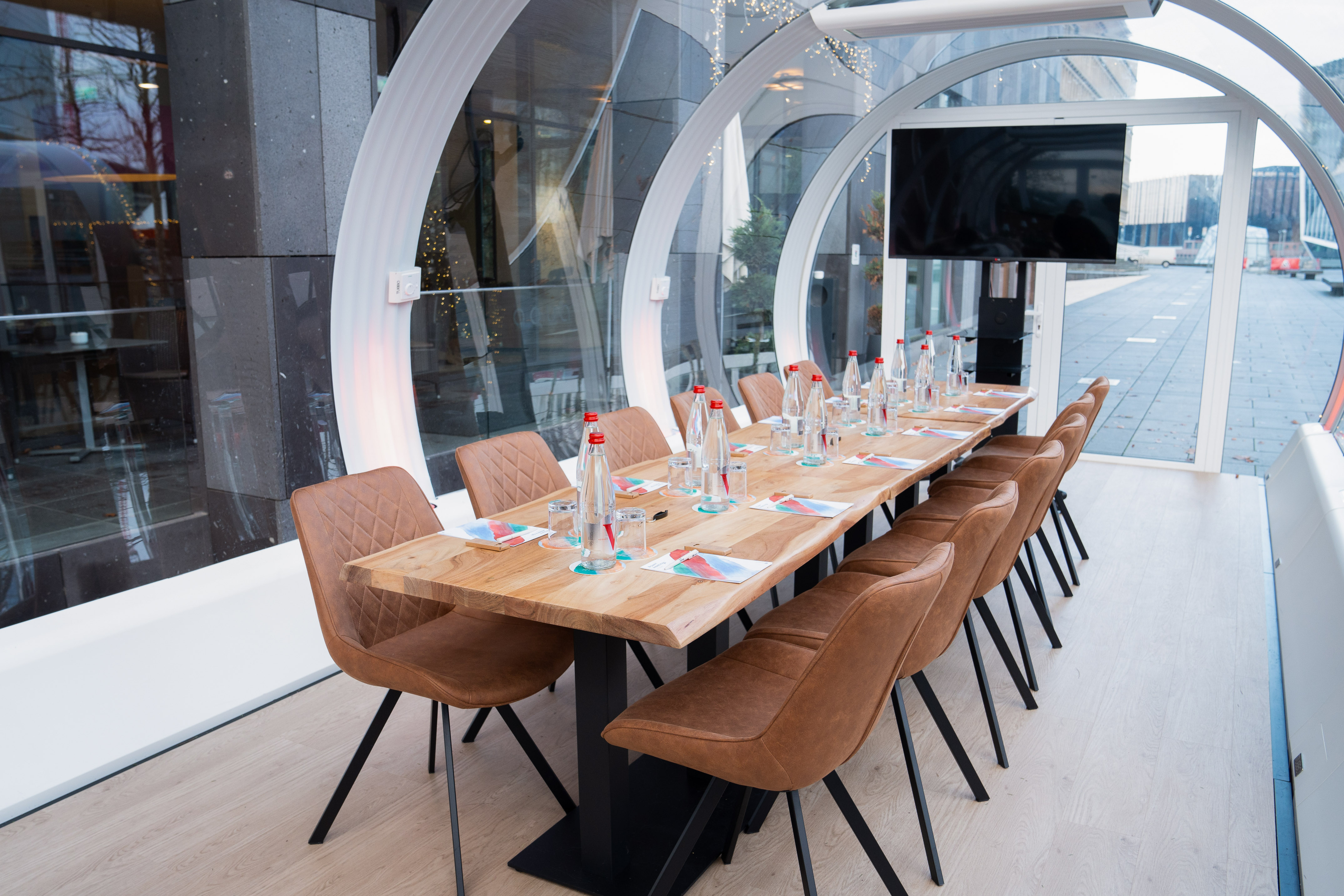 a table with chairs and bottles on it