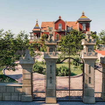 a gated driveway with trees and a house in the background