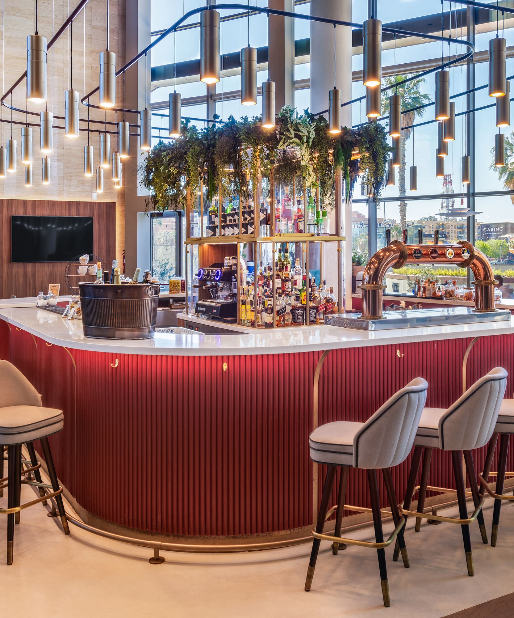 a bar with chairs and a bar stools