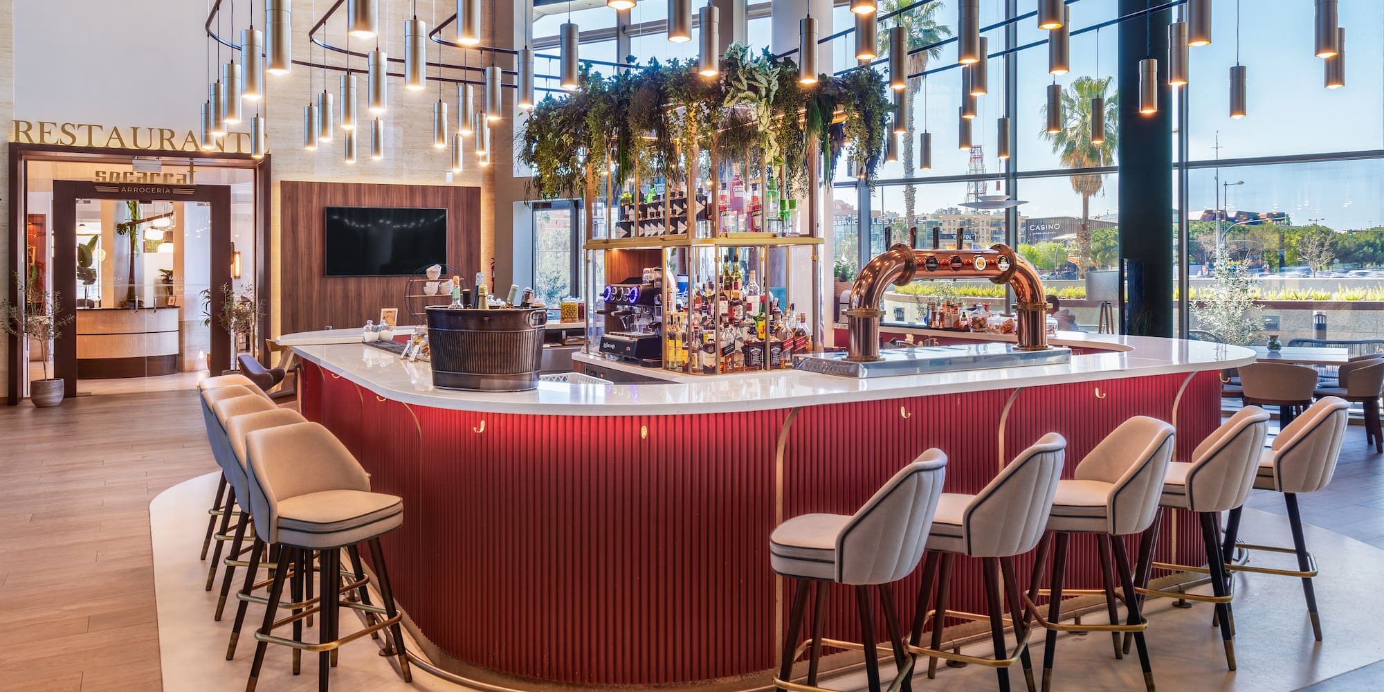 a bar with chairs and a bar stools