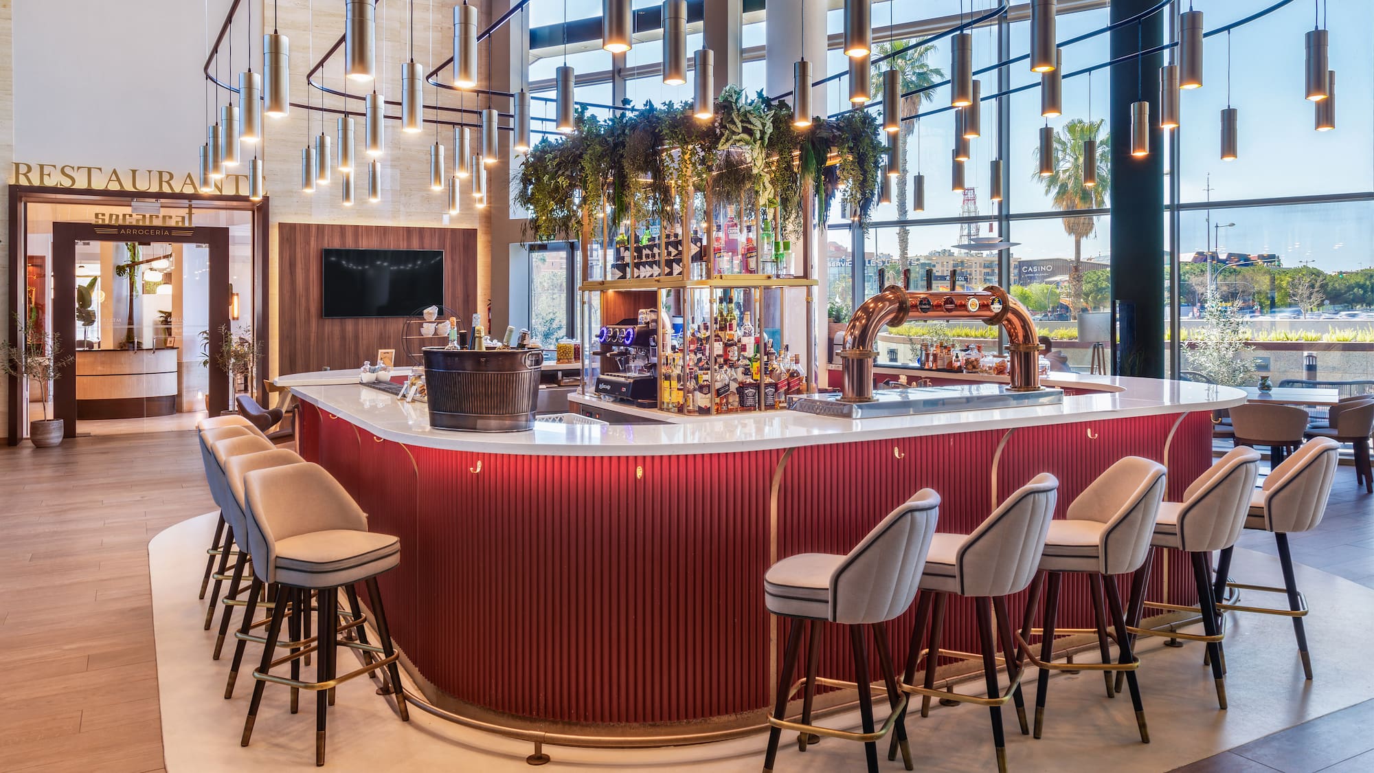 a bar with chairs and a bar stools
