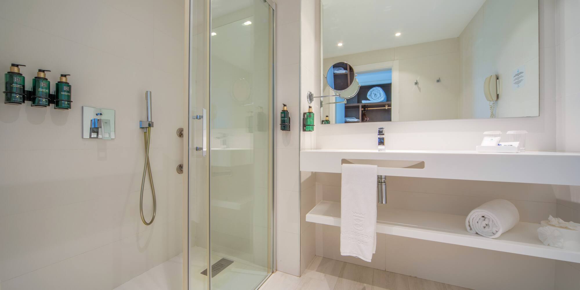 a bathroom with a shower and sink