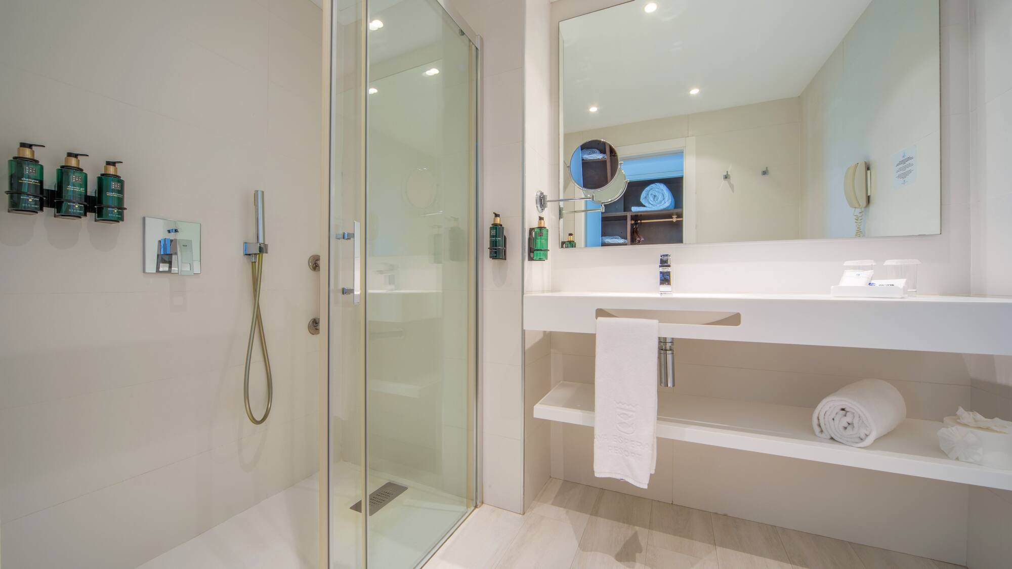 a bathroom with a shower and sink