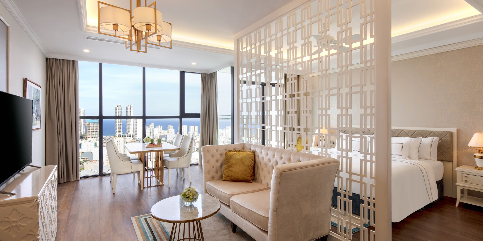 a room with a couch and a table and chairs