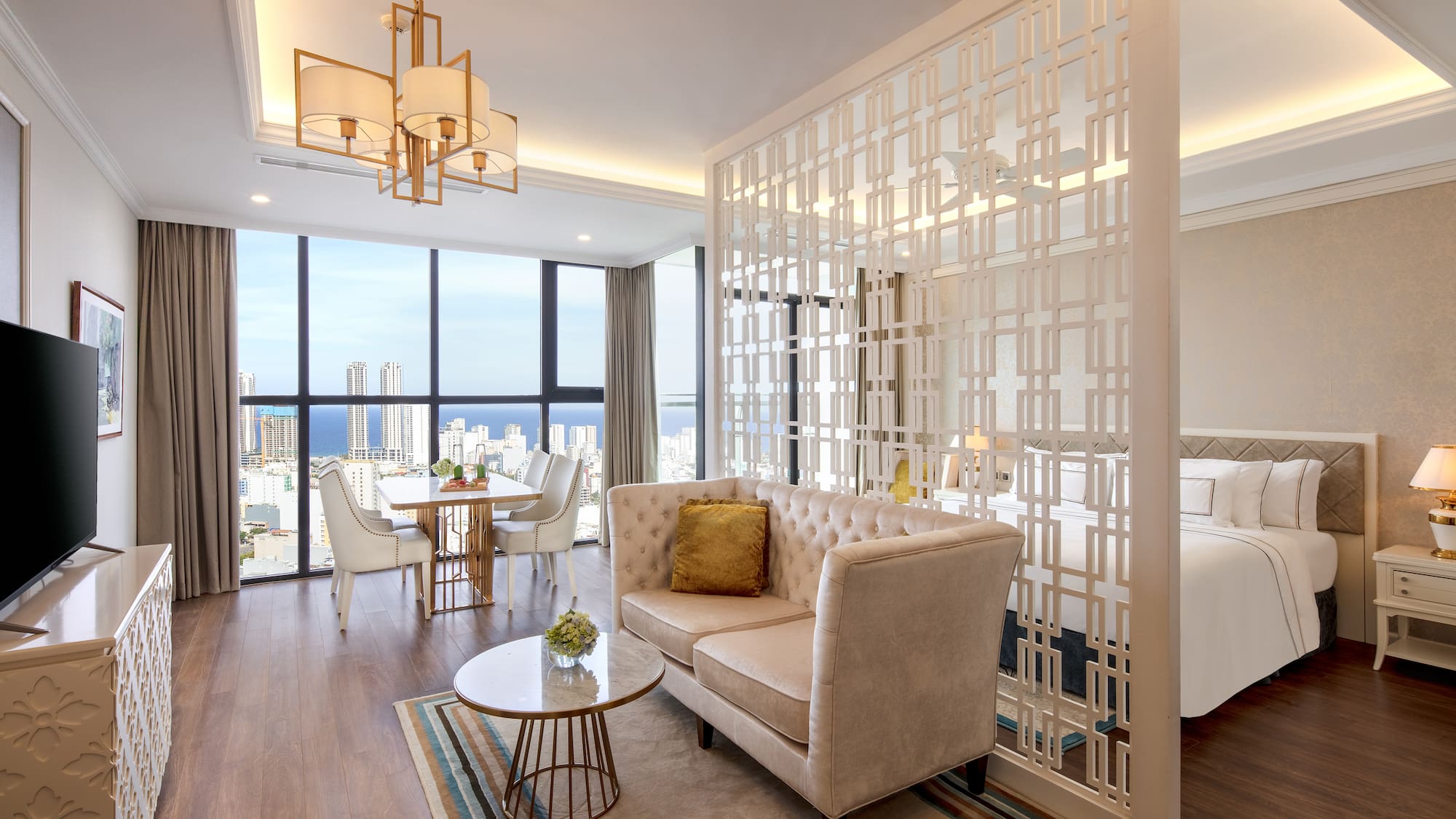 a room with a couch and a table and chairs