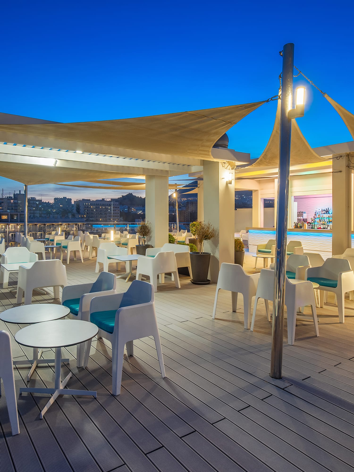 a patio with tables and chairs