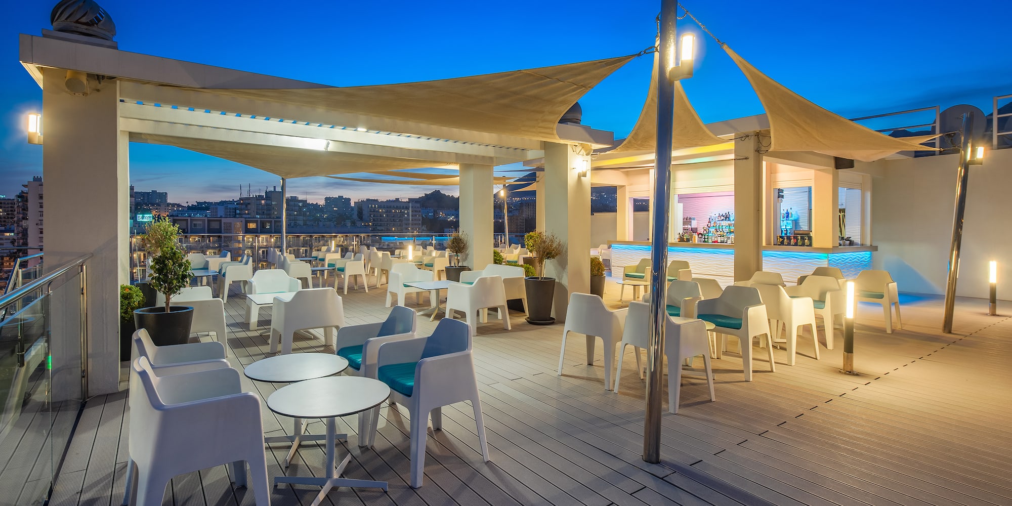 a patio with tables and chairs