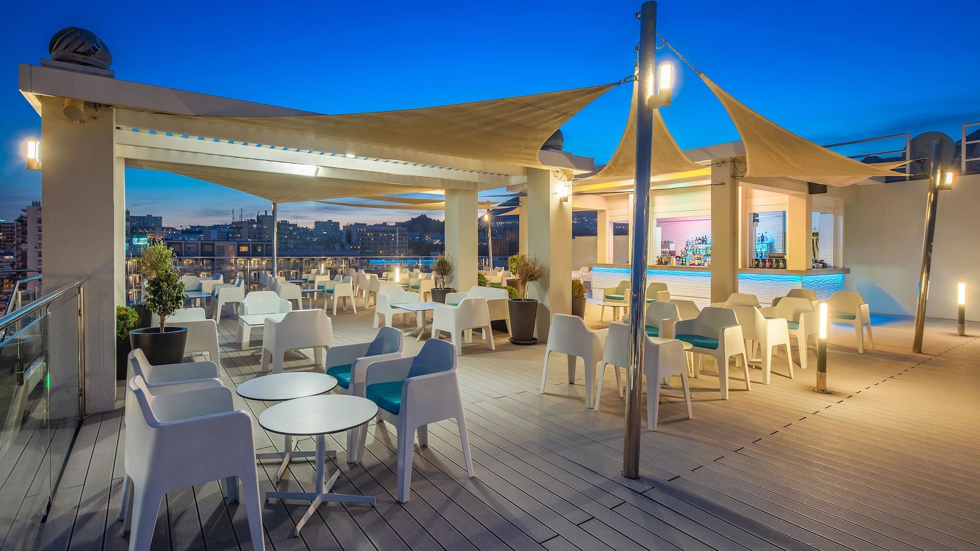 a patio with tables and chairs