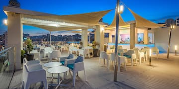 a patio with tables and chairs