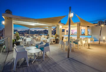 a patio with tables and chairs