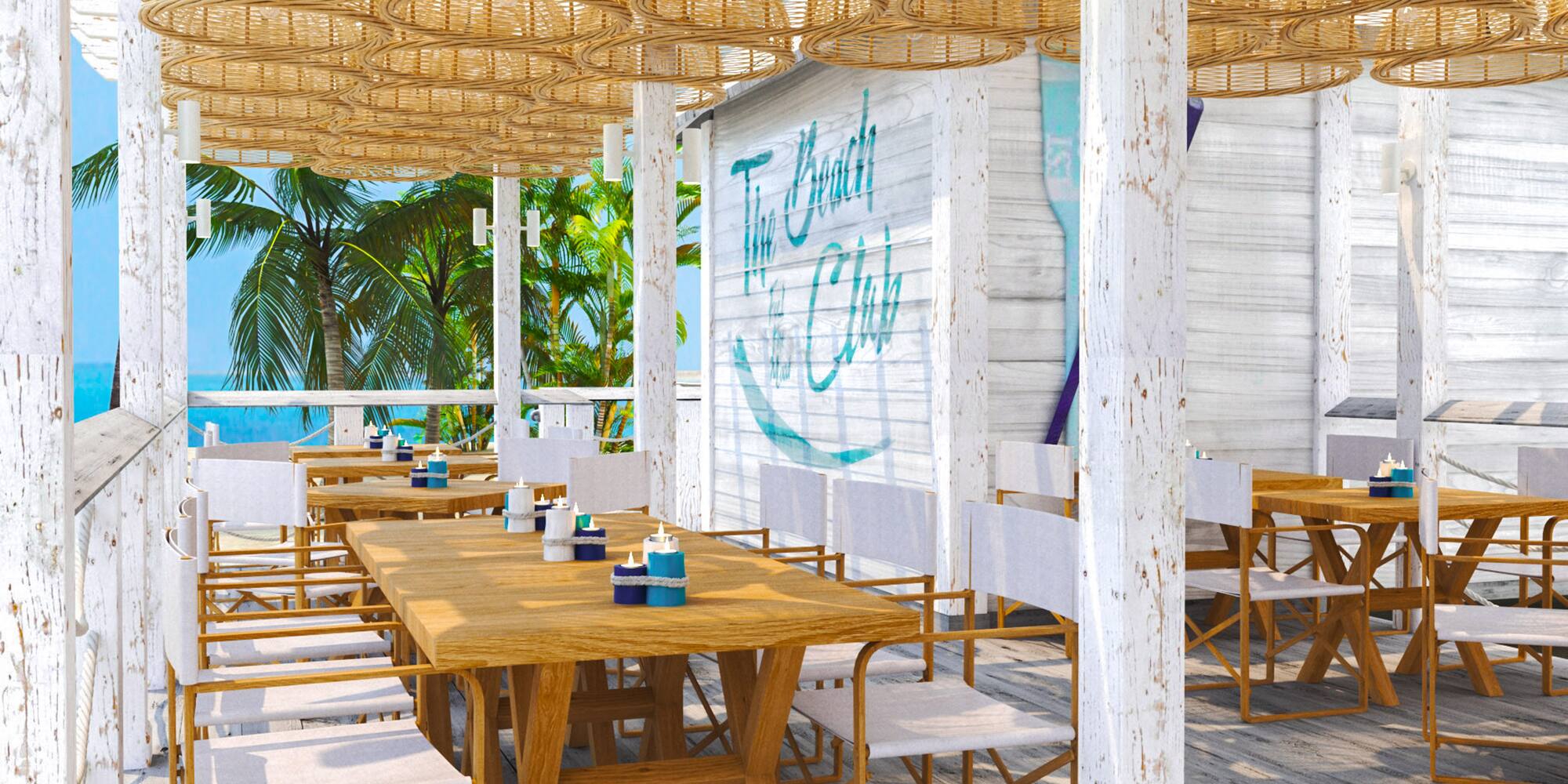 a table and chairs on a beach restaurant