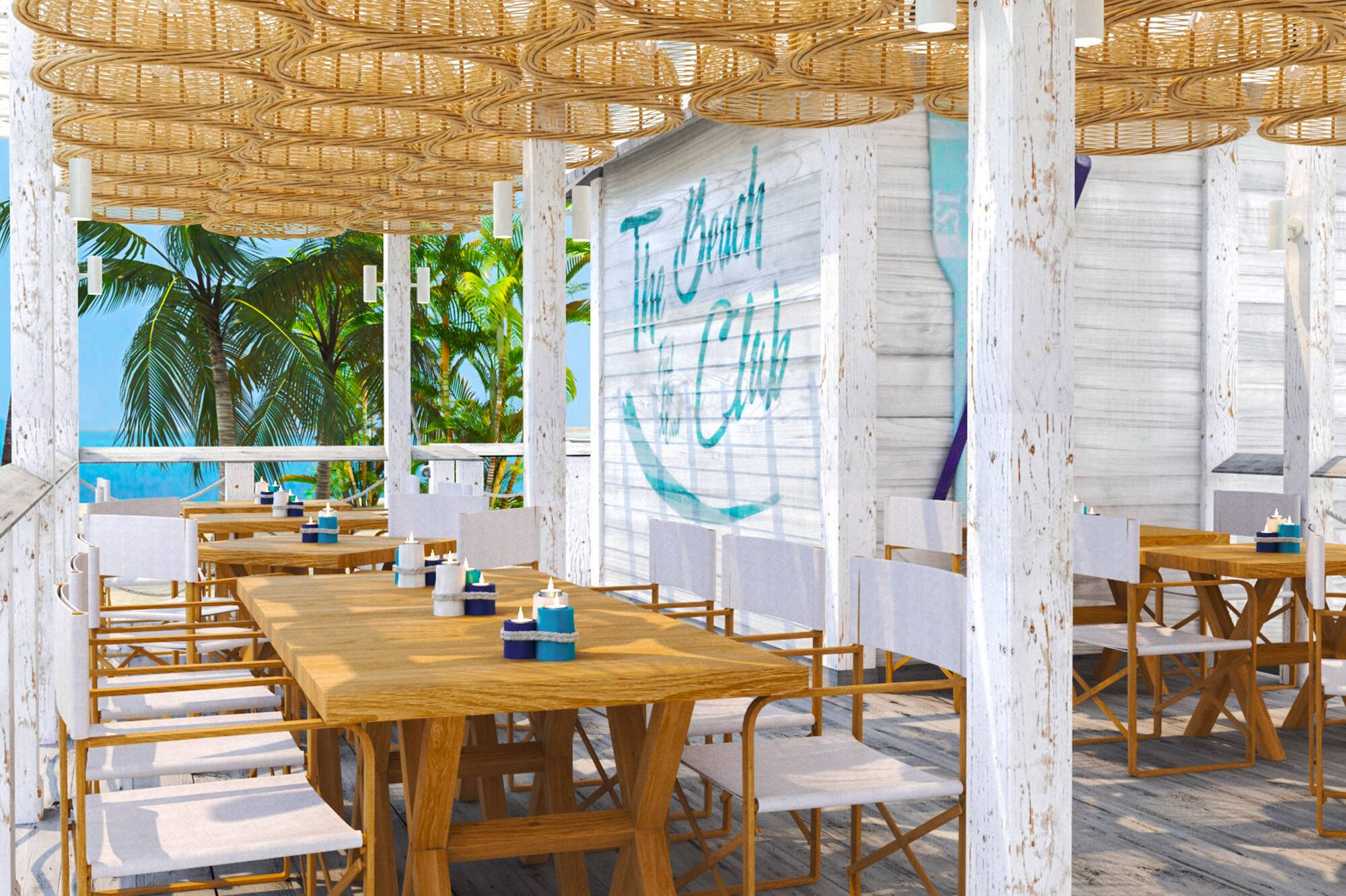 a table and chairs on a beach restaurant