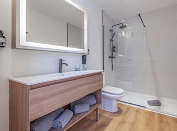 a bathroom with a mirror and a sink