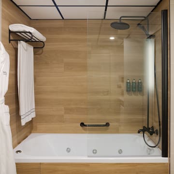 a bathtub and shower in a bathroom