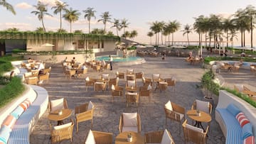 a group of people sitting at tables and chairs outside