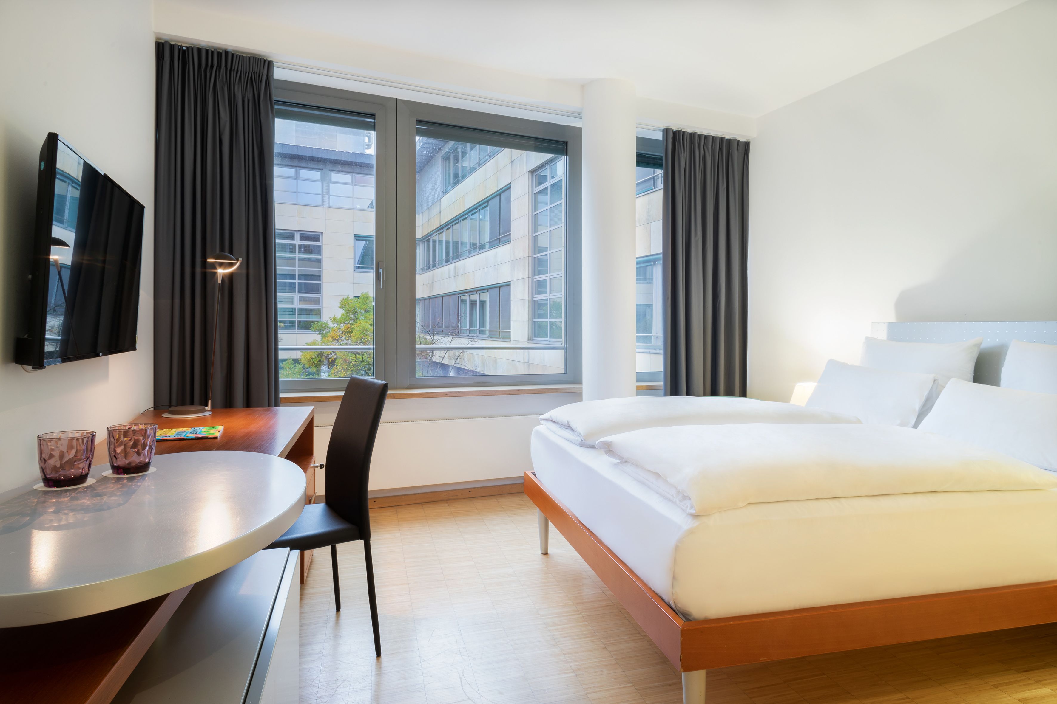 a room with a bed and a desk