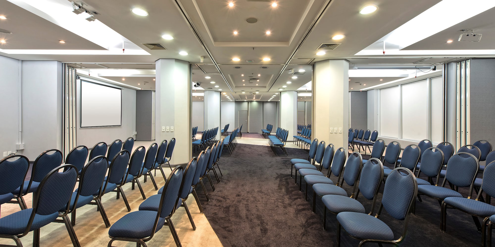 a room with rows of chairs