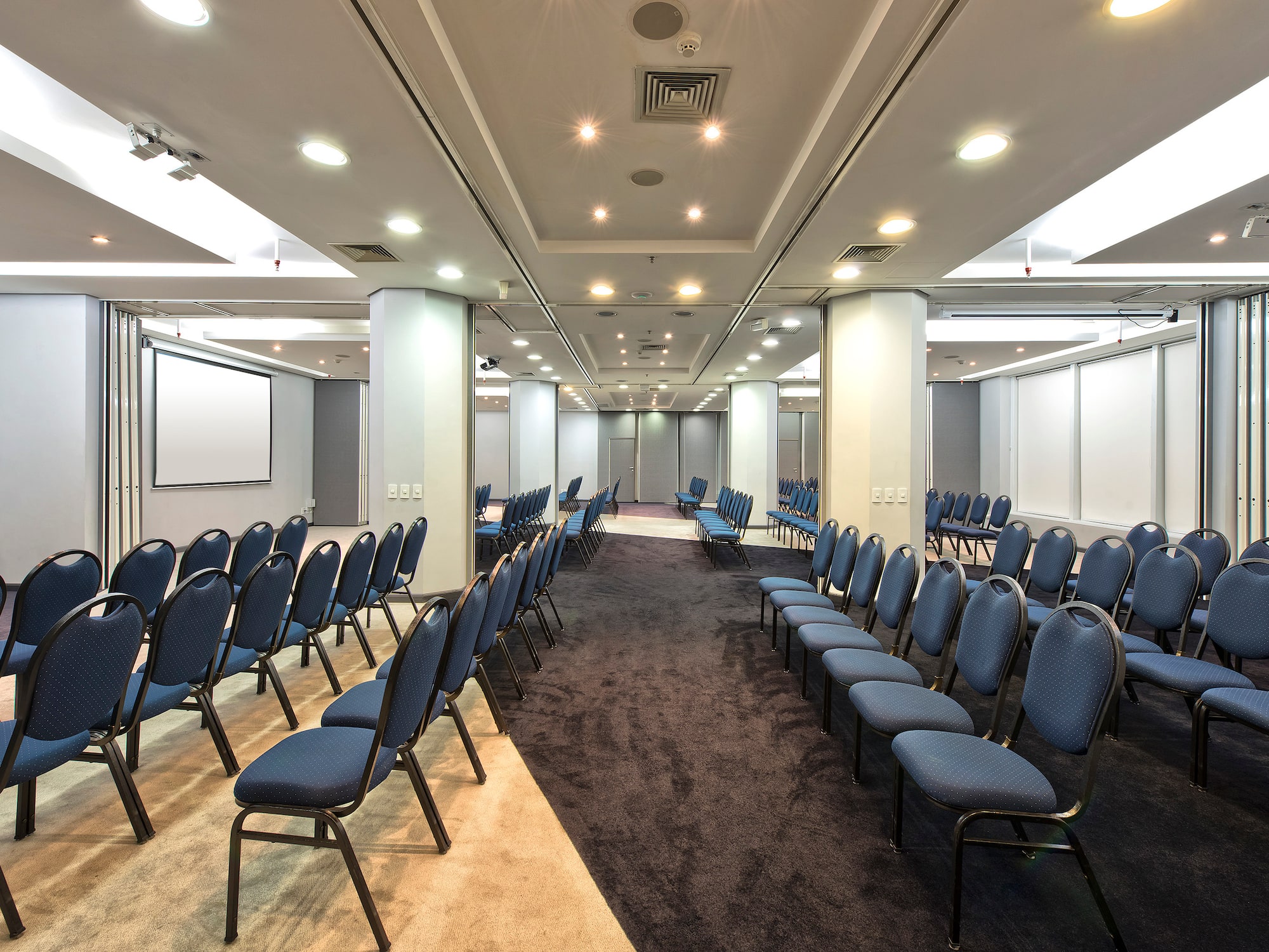 a room with rows of chairs