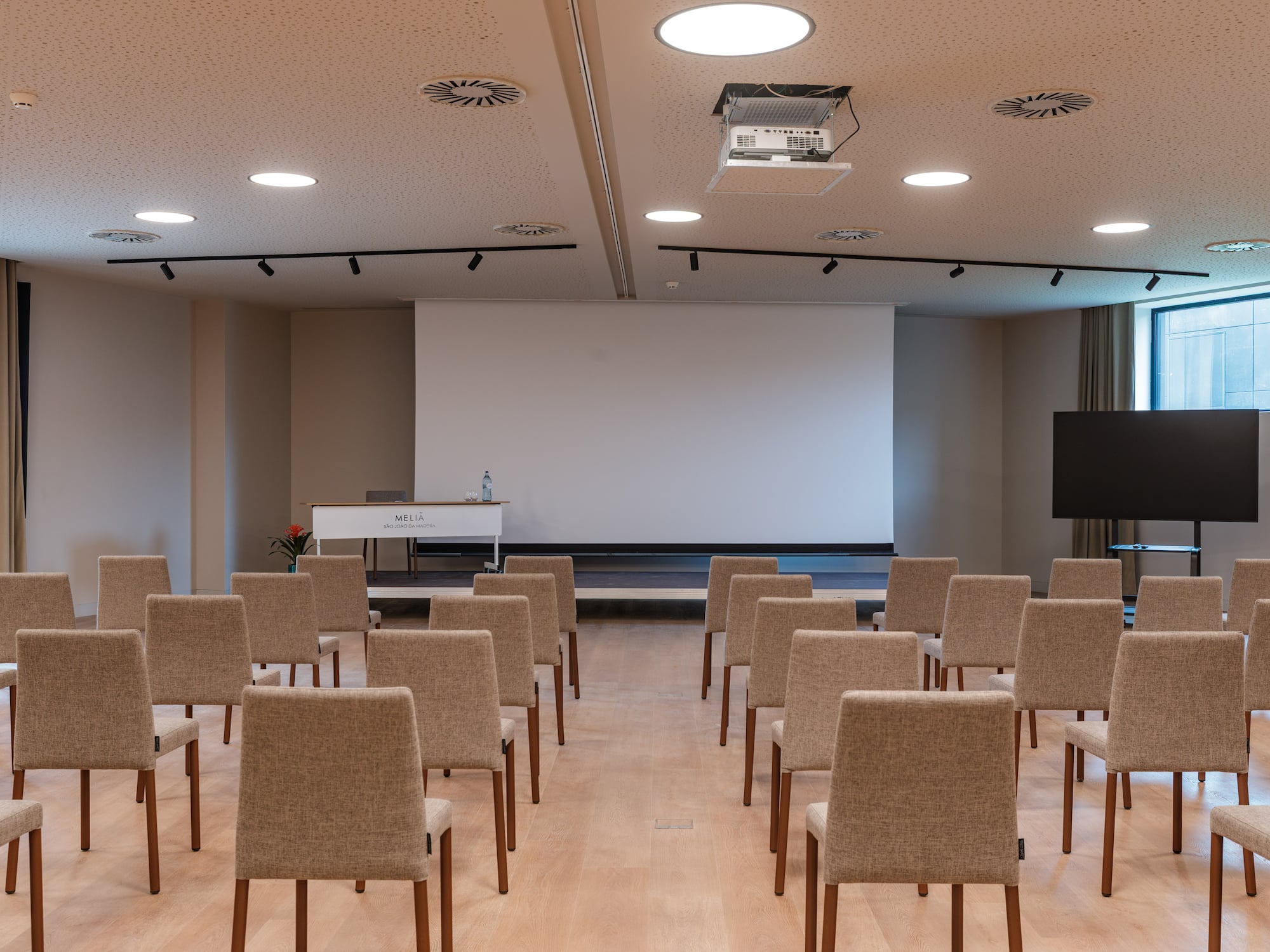a room with chairs and a projector