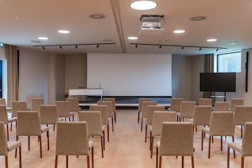 a room with chairs and a projector