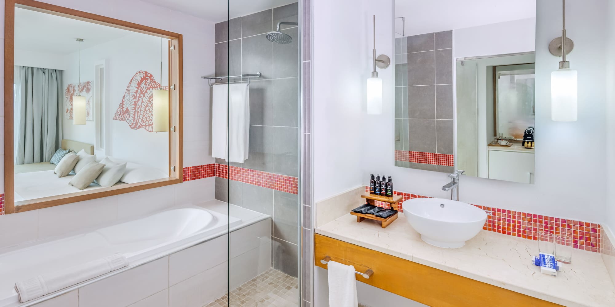 a bathroom with a glass shower door and sink