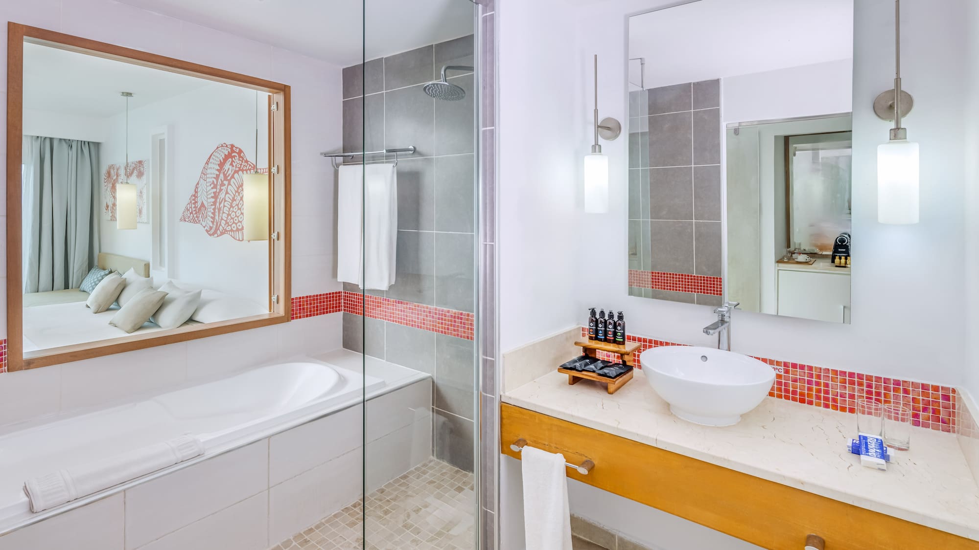 a bathroom with a glass shower door and sink