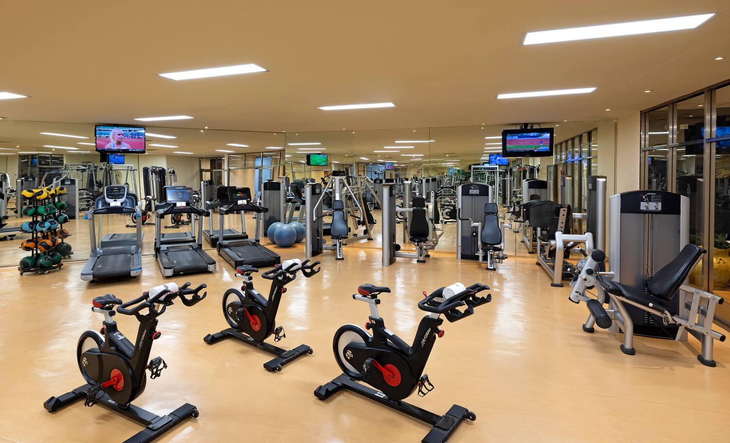 a large room with exercise equipment