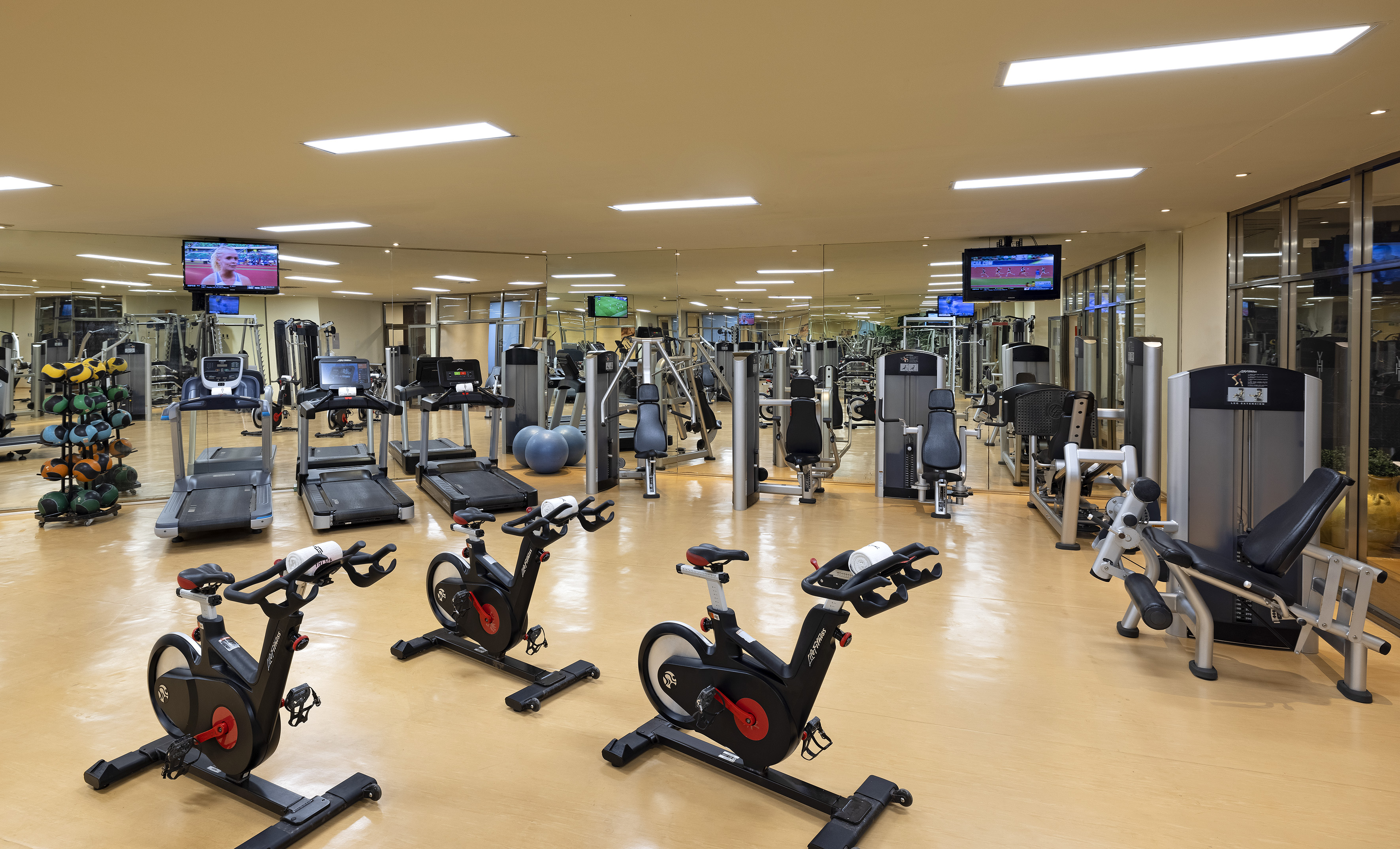 a large room with exercise equipment