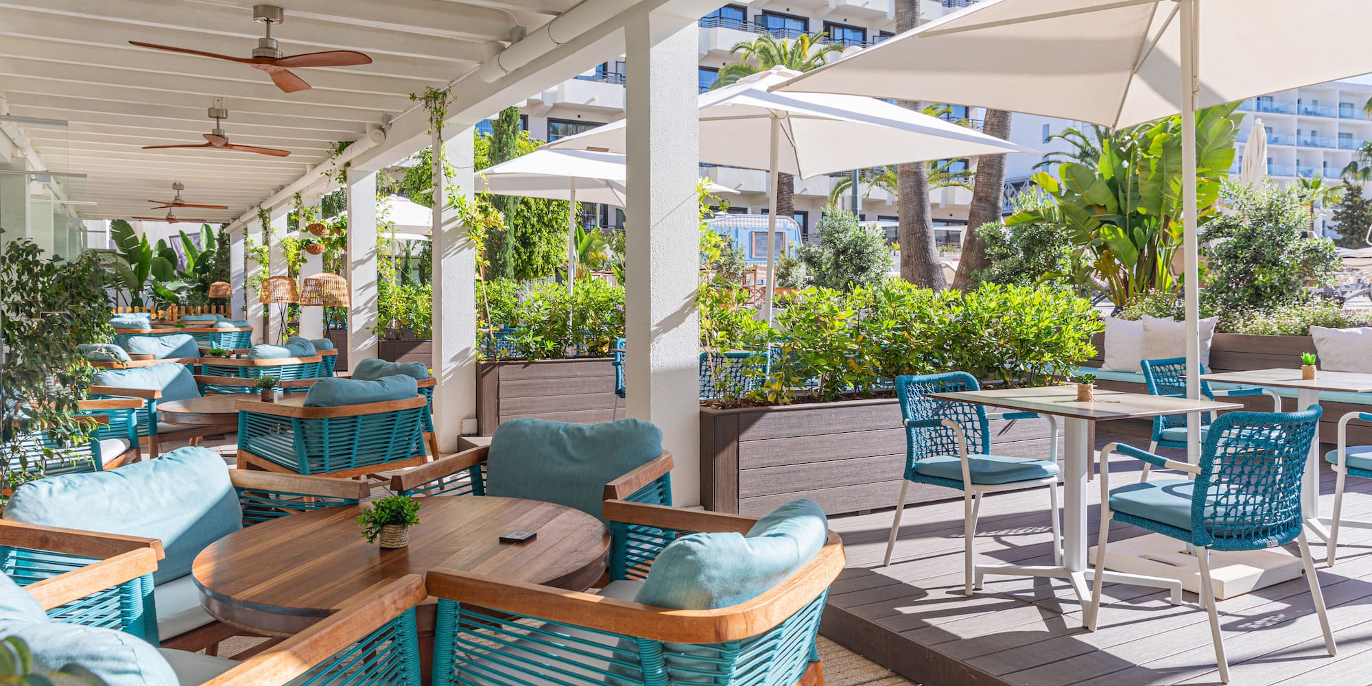 a patio with tables and chairs