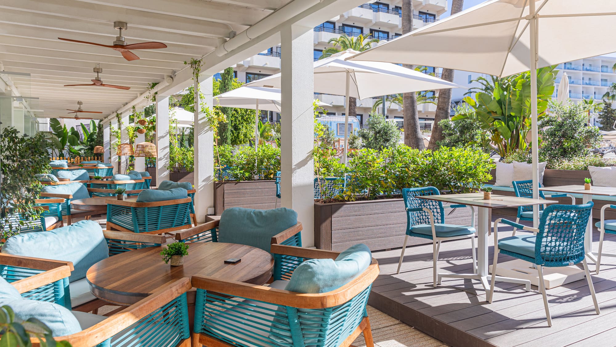a patio with tables and chairs