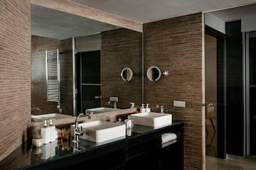 a bathroom with a mirror and sinks