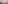Pink sunset over coastal city beach skyline with tranquil sea reflections.