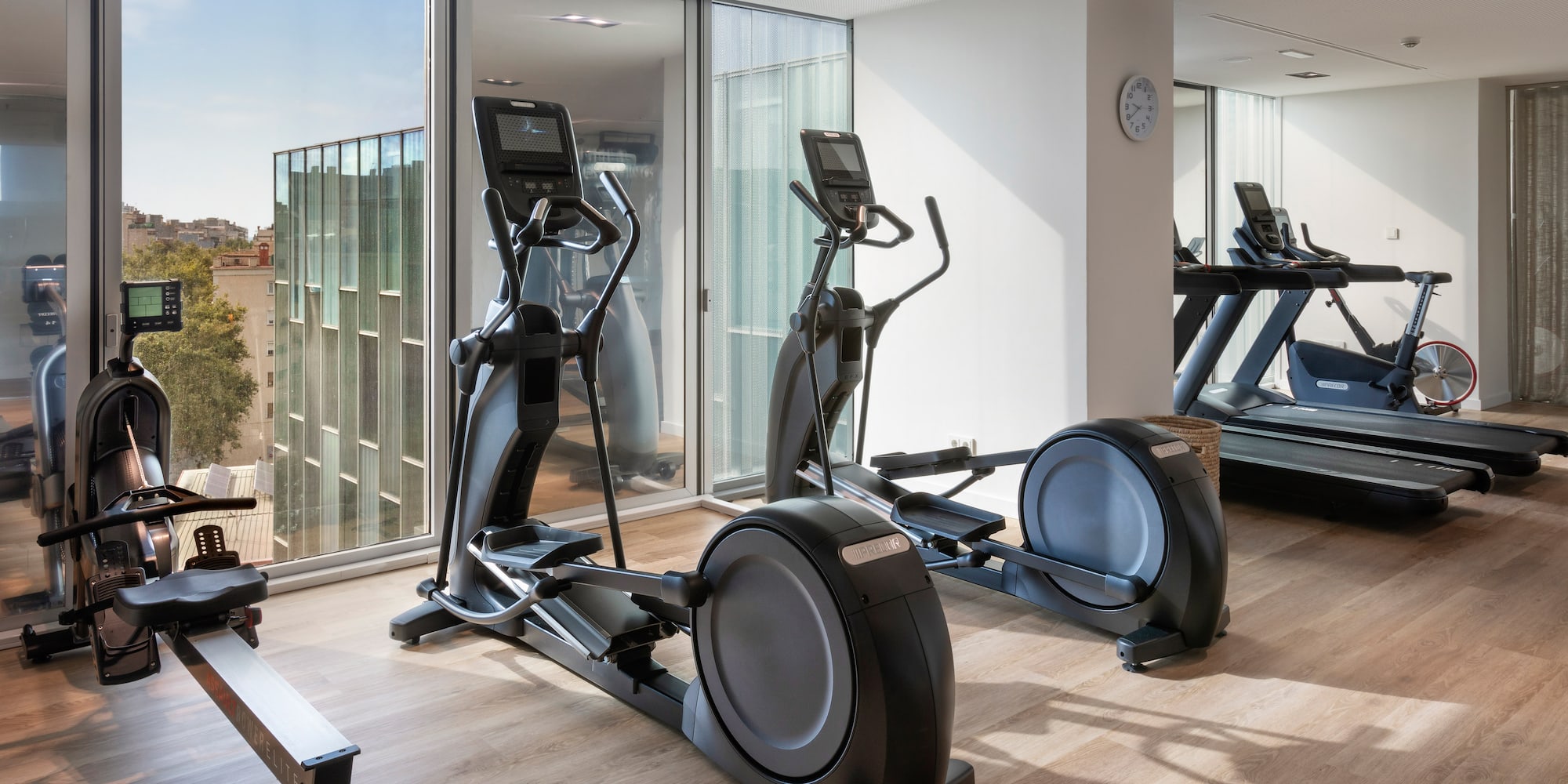 a room with exercise machines and a window