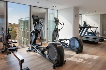 a room with exercise machines and a window