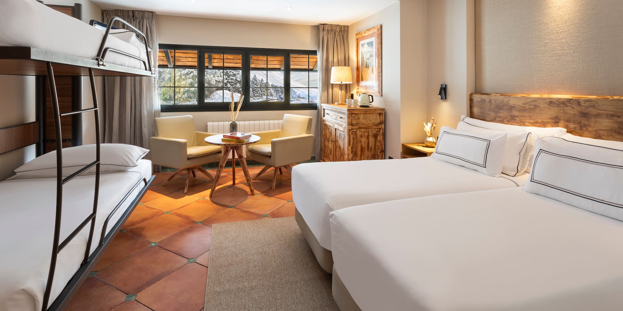 a room with two beds and a table