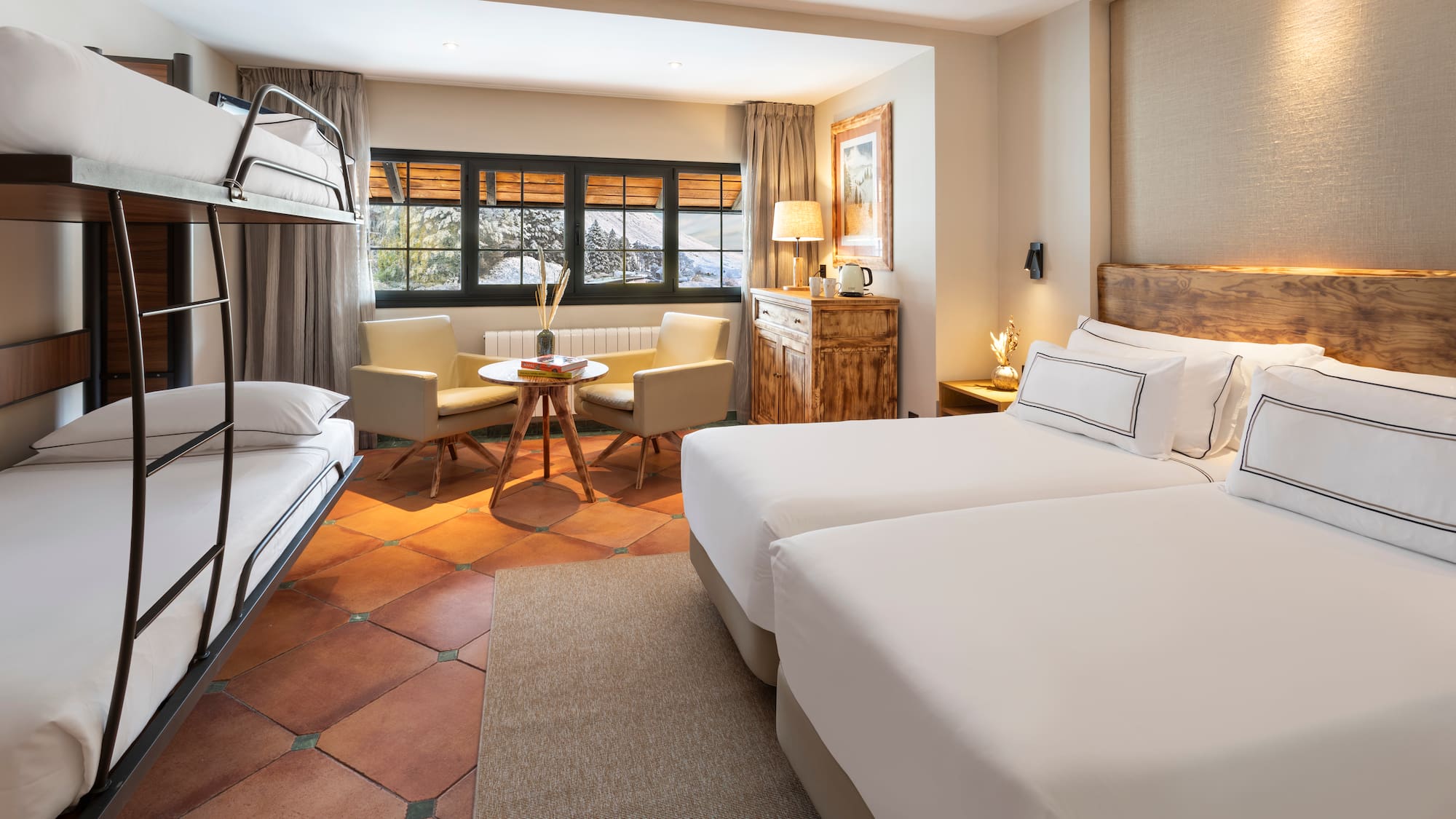 a room with two beds and a table