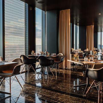 a room with tables and chairs