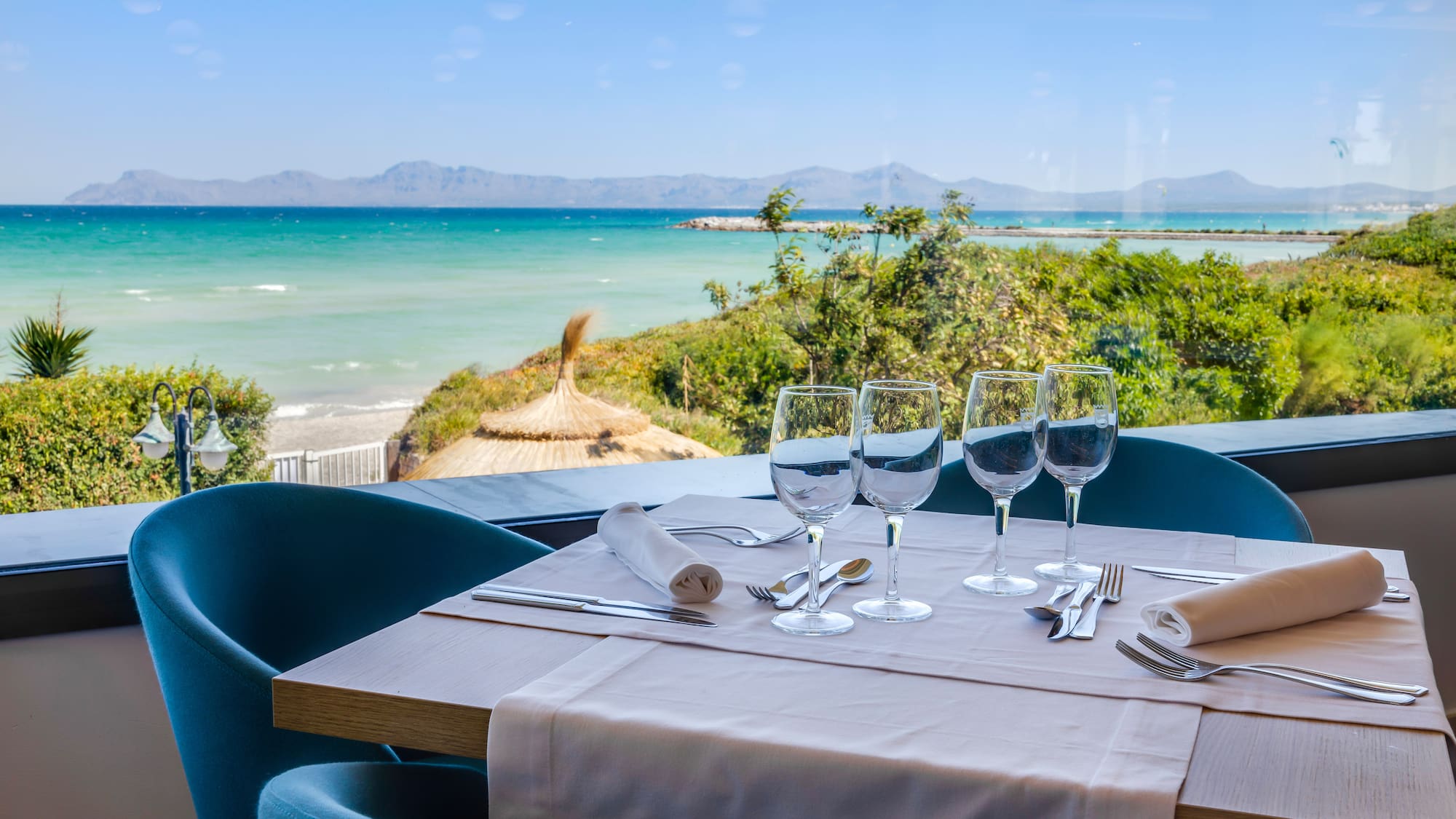 a table with glasses and utensils on it