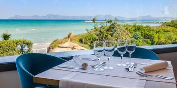 a table with glasses and utensils on it