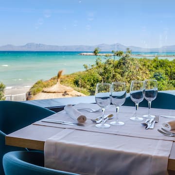 a table with glasses and utensils on it