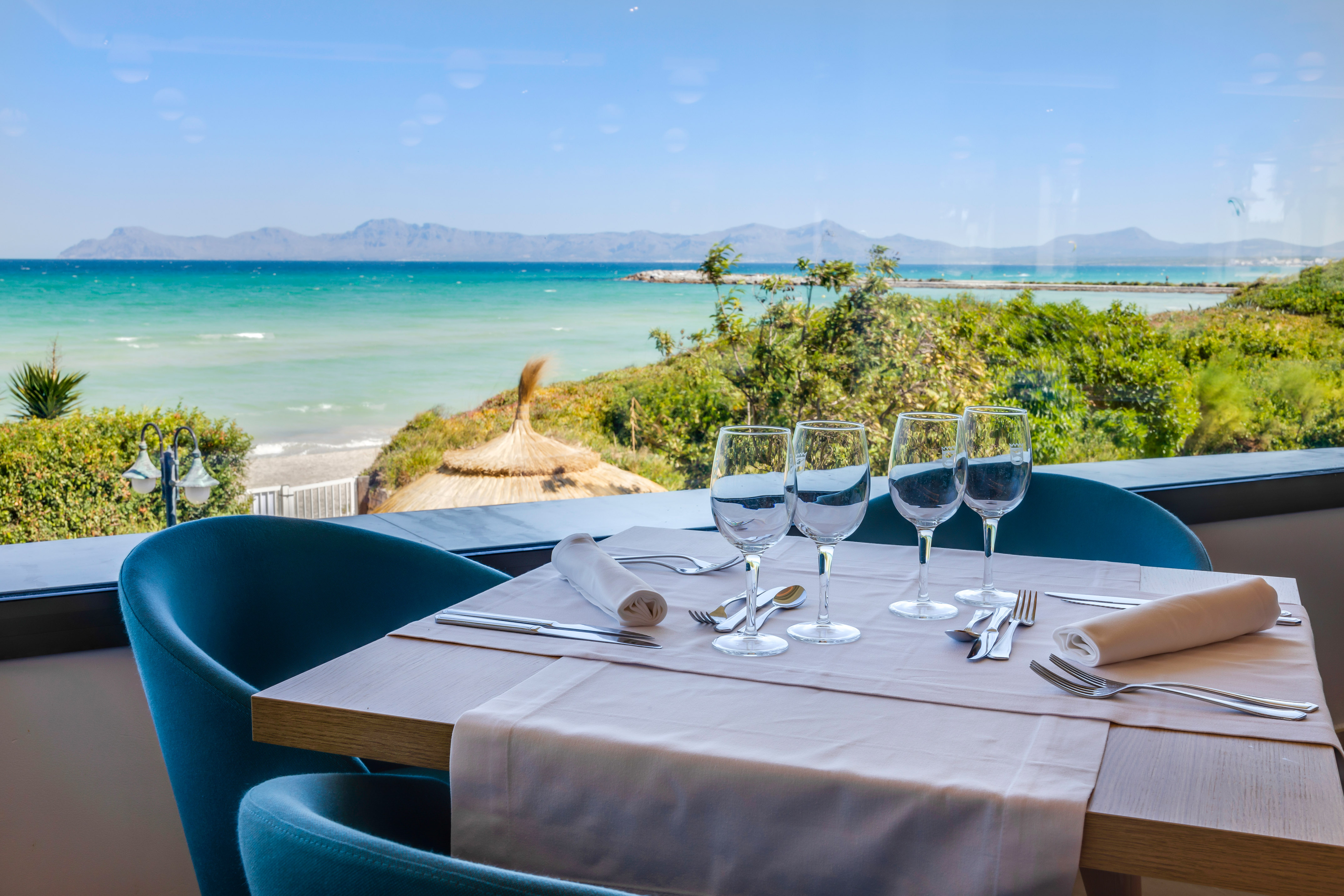 a table with glasses and utensils on it