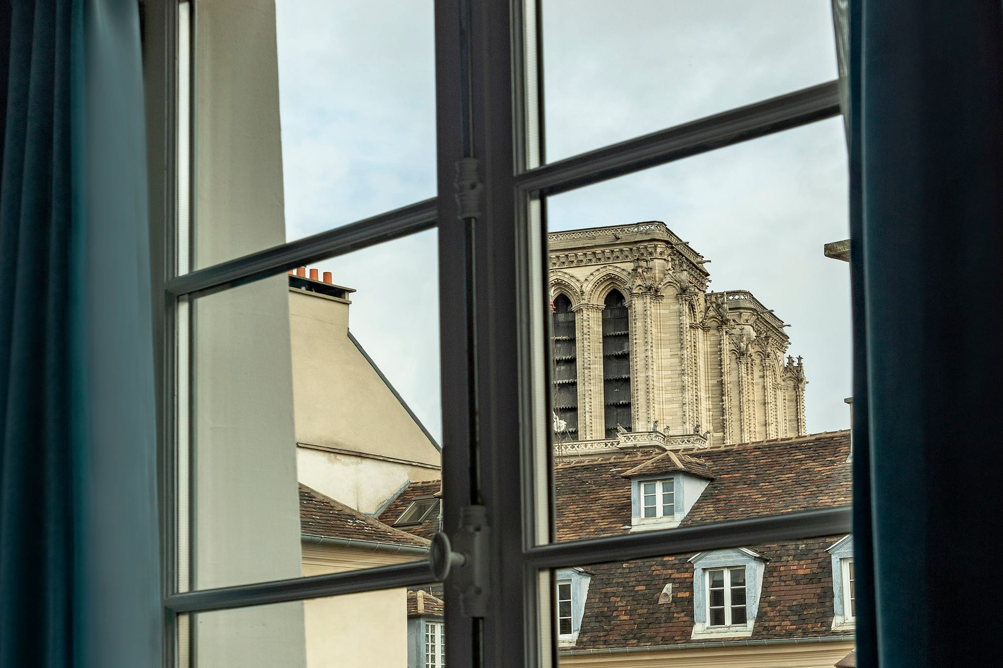 a window with a building in the background