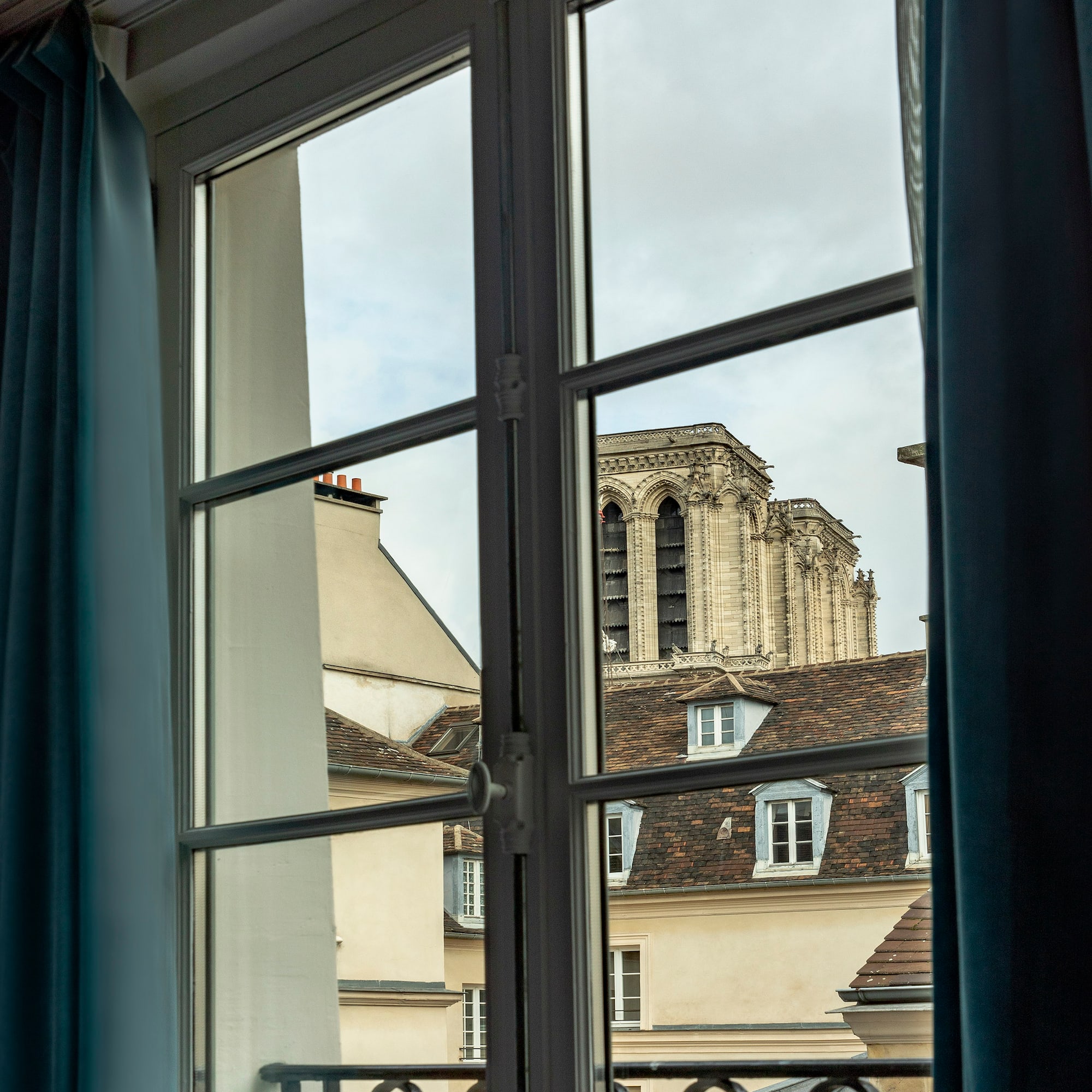 a window with a building in the background