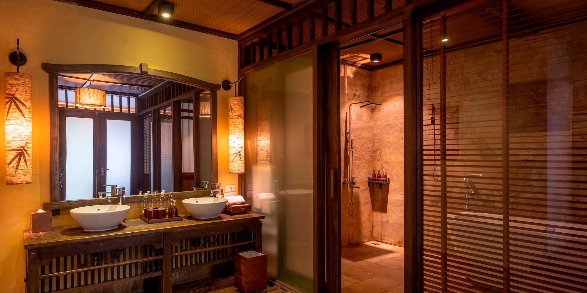 a bathroom with a shower and sinks