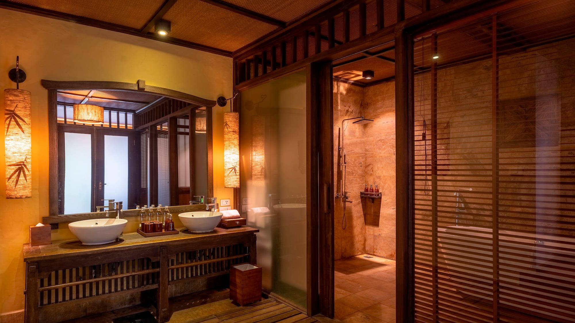 a bathroom with a shower and sinks